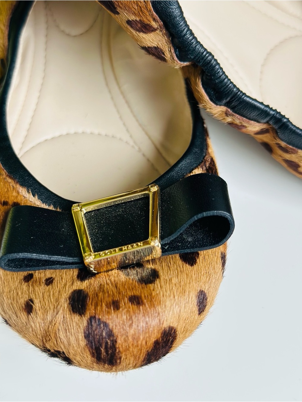 Cole Haan | Real fur Leopard -Print Ballet Flats with Black Bow and Gold Buckle